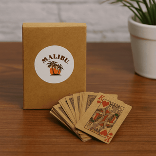 Eco Playing Cards - A set of eco-friendly playing cards in a brown box with a logo, featuring intricate designs in earthy tones.