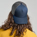 Rapper Cotton-S Organic/Recycled - A trucker cap in navy with a grey mesh back, displayed from the rear, featuring a logo.