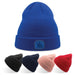 Kid Wind-S Beanie - Recycled Polyester - A collection of beanies in blue, black, navy, pink, and red, featuring a logo on the front of the blue beanie.