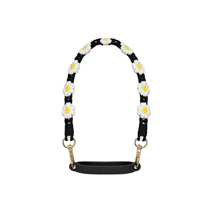 Woven Flower Tumbler Strap - A drink bottle strap featuring a black background with woven white and yellow daisies and gold clips.