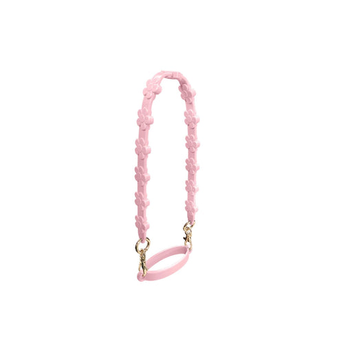 Silicone Flower Tumbler Strap - A drink bottle strap featuring pink silicone flowers and gold hardware, designed for tumblers.