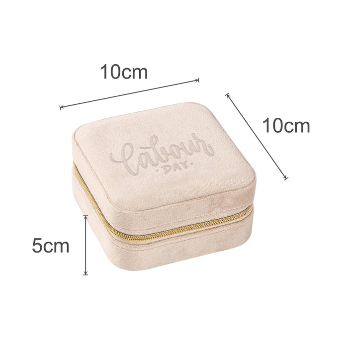 Velvet Jewellery Organizer - A velvet jewellery organiser in ivory, measuring 10cm x 10cm x 5cm, with a zip closure and a subtle logo.