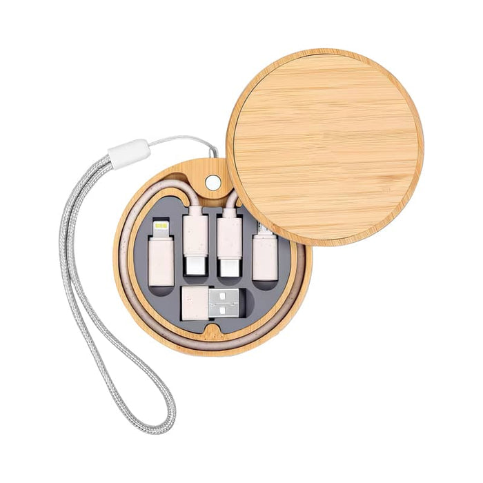 Coburg Pro Eco Cable Kit with 15W Wireless Charger - A bamboo round case containing a 15W wireless charger and various charging cables in silver and white.