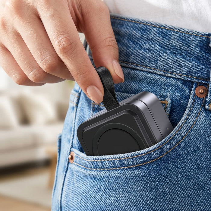 Everest 3-in-1 15W Magnetic Wireless Charging Station - A compact grey magnetic wireless charging station being placed in a pocket of denim jeans.