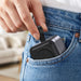 Everest 3-in-1 15W Magnetic Wireless Charging Station - A compact grey magnetic wireless charging station being placed in a pocket of denim jeans.
