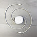 Paulo 100W Retractable Charging Data Cable - A retractable charging data cable in white, coiled with connectors at both ends, laid on a light wooden surface.