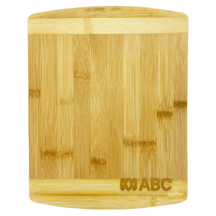 Tiga Bamboo Cutting Board - A bamboo cutting board with a smooth surface and rounded edges, featuring a logo in one corner.