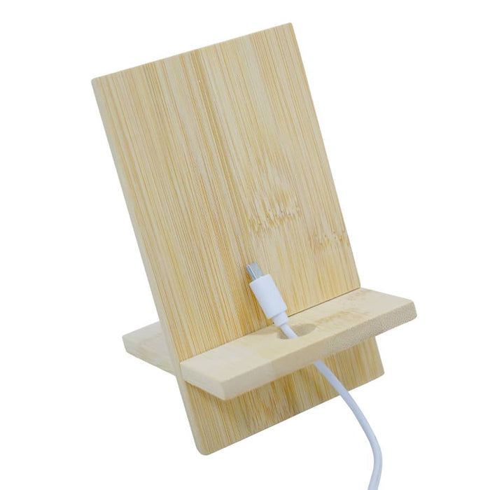 Groove Bamboo Phone Stand - A bamboo phone stand with a slot for charging, featuring a natural wood finish and clean design.