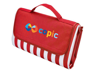 Ascot Picnic Rug, Red - Extra Large - A red picnic rug with a striped pattern and a handle, featuring a logo on the front.