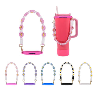 Woven Flower Tumbler Strap - A drink bottle with a pink woven flower tumbler strap, displayed alongside various strap colours.