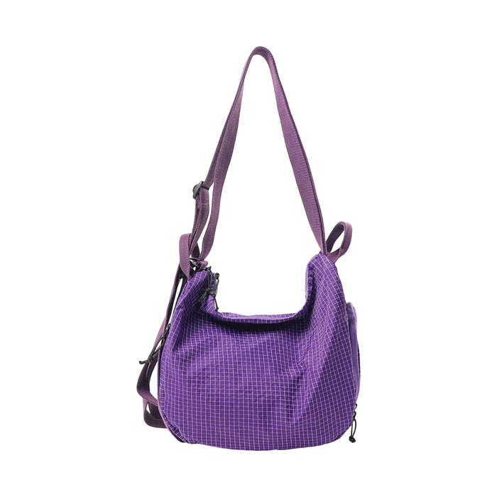 Convertible Lightweight Backpack Duffel Bag - A purple convertible lightweight backpack duffel bag with an adjustable strap and zippered compartments.