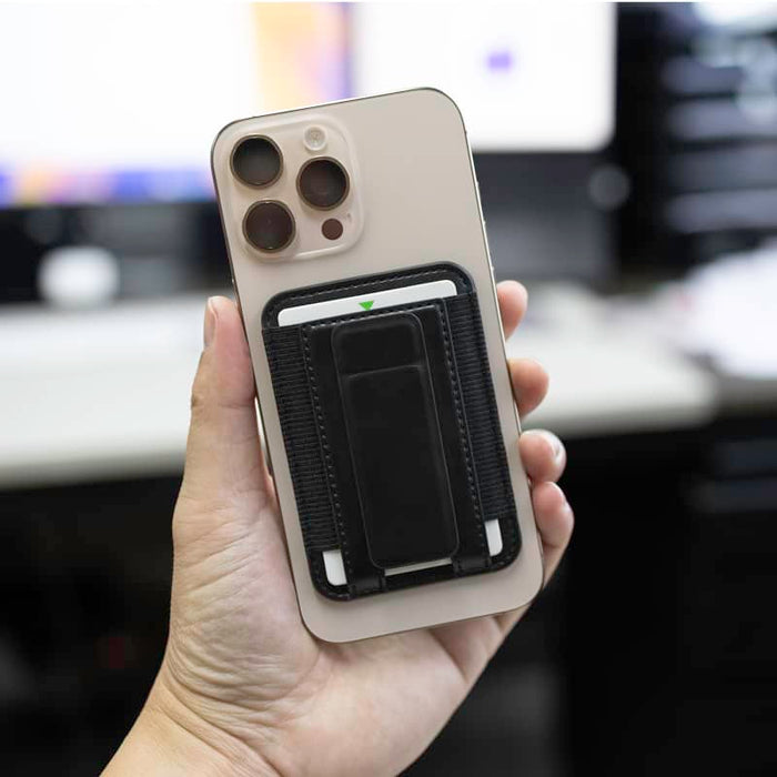 Wally Stand - A smartphone with a black cardholder attachment, featuring a sleek design and a neutral-coloured case.