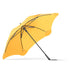 BLUNT Exec Umbrella - A yellow umbrella with a sleek design and a sturdy black frame, featuring a branding logo.