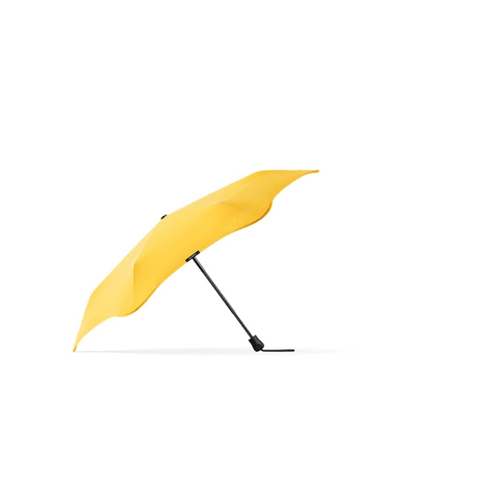 BLUNT Neo Umbrella - A yellow BLUNT Neo Umbrella with a curved canopy and a black support arm. It features a logo on the handle.