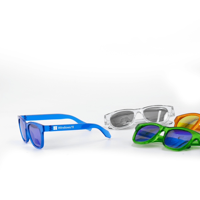 Summer Polarised Sunglasses - A pair of blue sunglasses alongside green, orange, and clear sunglasses, featuring a logo on the blue pair.