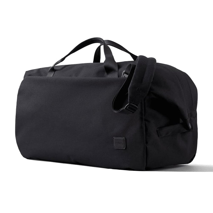 Bellroy Classic Duffel 45L - A black duffel bag with handles and an adjustable strap, featuring a small logo on the side.