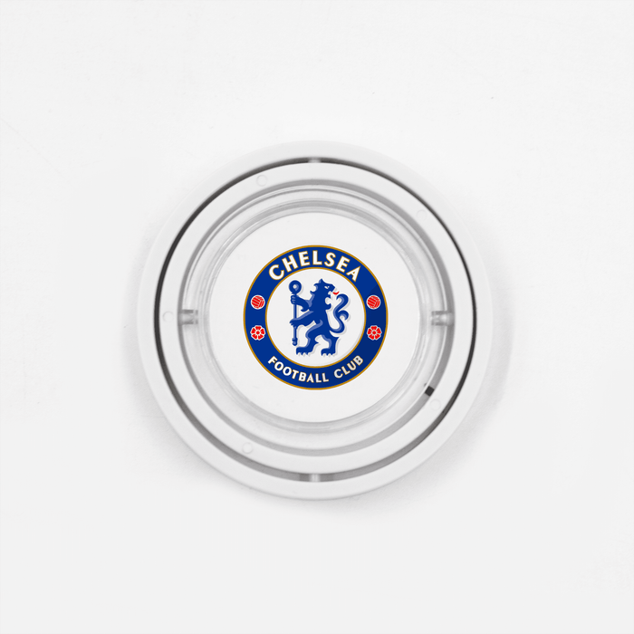 The Amazing Fidget - A circular glass ashtray featuring a logo in blue and white for a football club, with a silver rim.