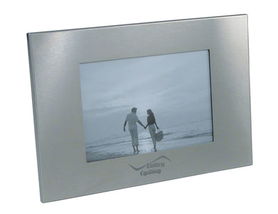 Milan Photo Frame, Single - A silver photo frame with a rectangular shape, featuring a central opening for a photo and a logo on the bottom.
