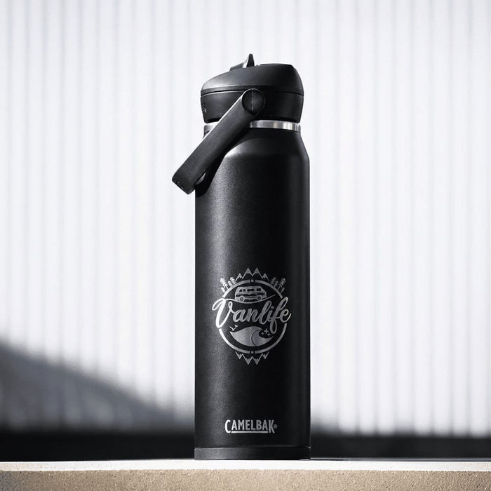CamelBak - Thrive Flip Straw VSS 1.0L - A drink bottle in matte black with a flip straw lid and a logo featuring a vanlife theme.