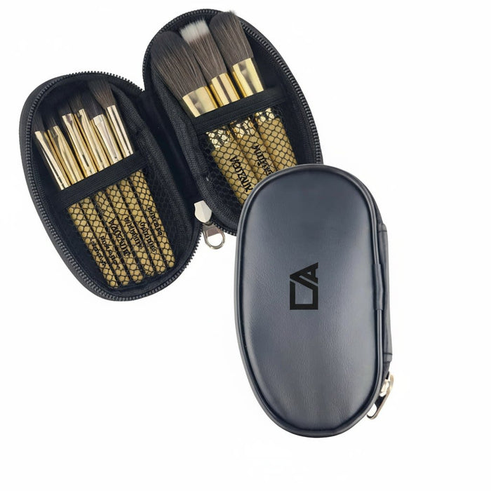 9 Brushes in a Case - A case with nine brushes featuring gold handles and black bristles, enclosed in a black zippered pouch.