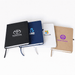 NFC A5 Smart Notebook - A set of four A5 smart notebooks in black, blue, white, and brown, each featuring a logo on the cover.