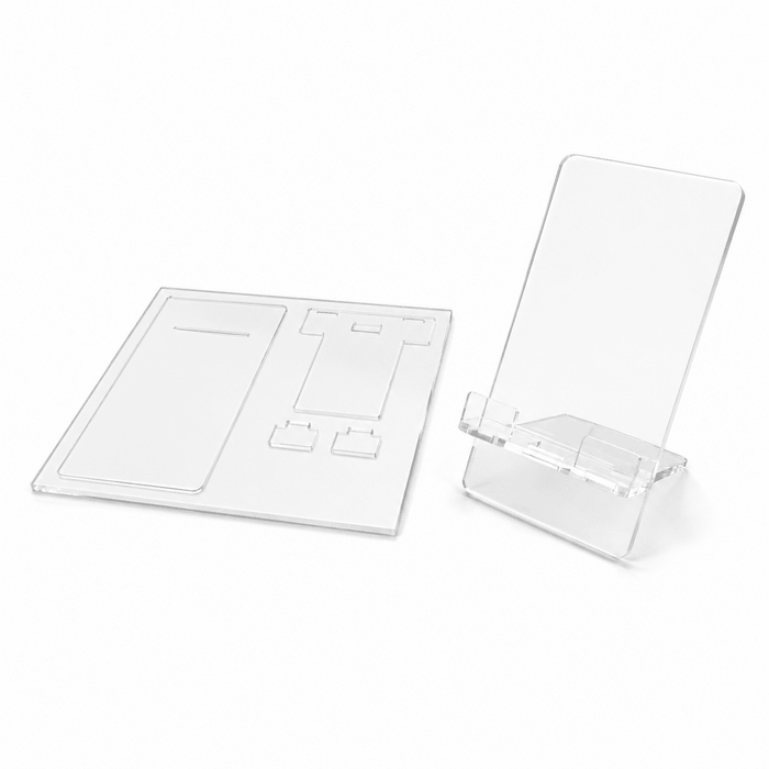 DIY Acrylic Phone Stand - A clear acrylic phone stand next to flat acrylic pieces for assembly. The design is simple and modern.