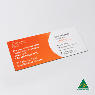 DL Envelope Size Magnet (99mm x 210mm) - A rectangular, double-sided business card featuring orange and white colours, with contact details and a logo.