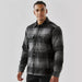Men's Highland Sherpa Lined Plaid Jacket - A men's black and grey plaid jacket with a Sherpa lining and button front, featuring two chest pockets and a logo.
