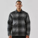 Men's Highland Sherpa Lined Plaid Jacket - A men's black and grey plaid jacket featuring a Sherpa lining and front pockets, with a branded logo.