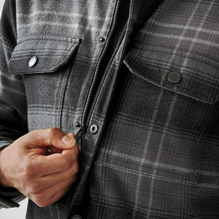 Men's Highland Sherpa Lined Plaid Jacket - A men's plaid jacket in shades of grey, featuring a Sherpa lining and front pockets, with a zipper being fastened.
