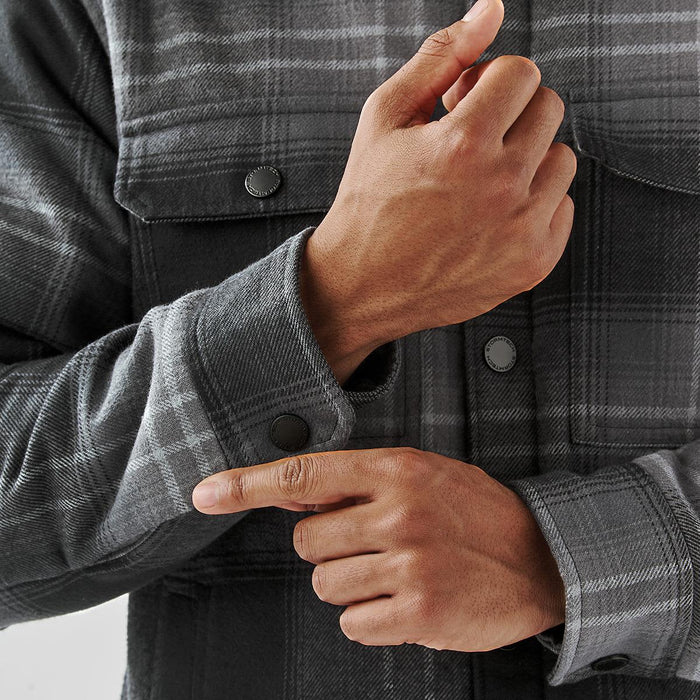 Men's Highland Sherpa Lined Plaid Jacket - A men's plaid jacket in grey tones with a Sherpa lining, featuring snap buttons on the cuffs.