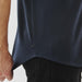 Men's Sonora Short Sleeve Knit Shirt - A navy blue short sleeve knit shirt with a curved hem and a small logo tag on the side.
