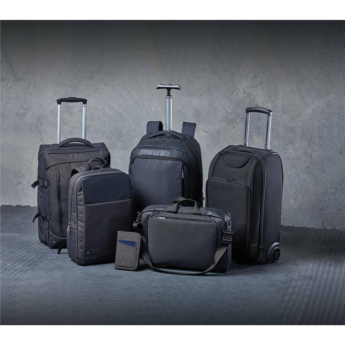 Road Warrior Computer Pack - A collection of black bags, including backpacks, a wheeled suitcase, and a messenger bag, with a sleek design.