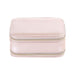 Fashion PU Leather Jewellery Case with Mirror - A pink PU leather jewellery case featuring a zip closure and a mirror inside. It has a simple, elegant design.