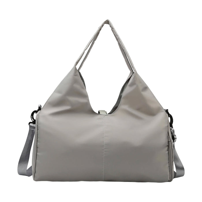 Duffle Bag With Yoga Mat Strap - A grey duffle bag featuring a yoga mat strap and an adjustable shoulder strap, with a sleek design and logo present.