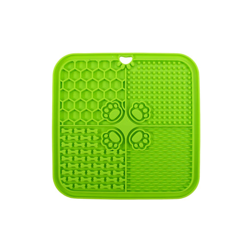 4-Section Dog Enrichment Lick Mat - A green, four-section dog enrichment lick mat featuring various textured patterns, including bones and paw prints.