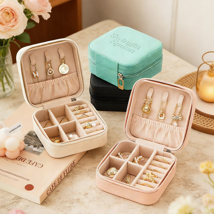 PU Leather Jewellery Box - A set of PU leather jewellery boxes in mint green, black, cream, and pink, featuring various compartments for accessories.