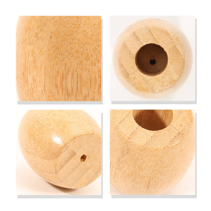 Bamboo Toothbrush Stand - A bamboo toothbrush stand featuring a smooth, natural finish and rounded design. It has a small hole for toothbrush placement.