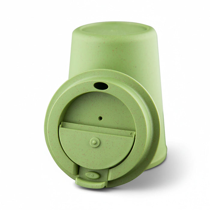 Karvo Kuppa – EcoBlend - A drink bottle with a green eco-friendly design and a flip-top lid. It features a logo on its side.