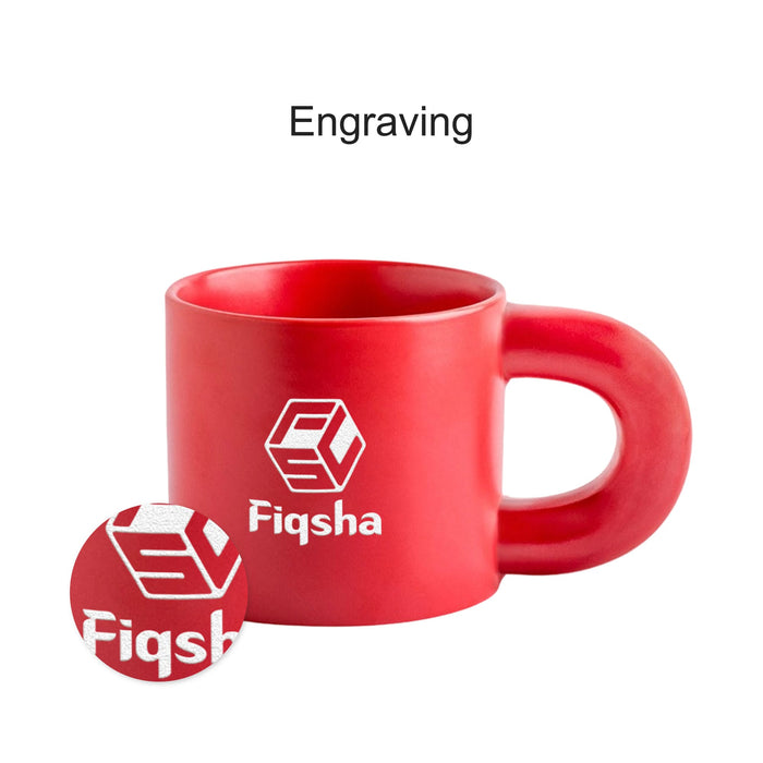 Laser Engraving Ceramic Coffee Mug - A red ceramic coffee mug with a large handle and an engraved logo.