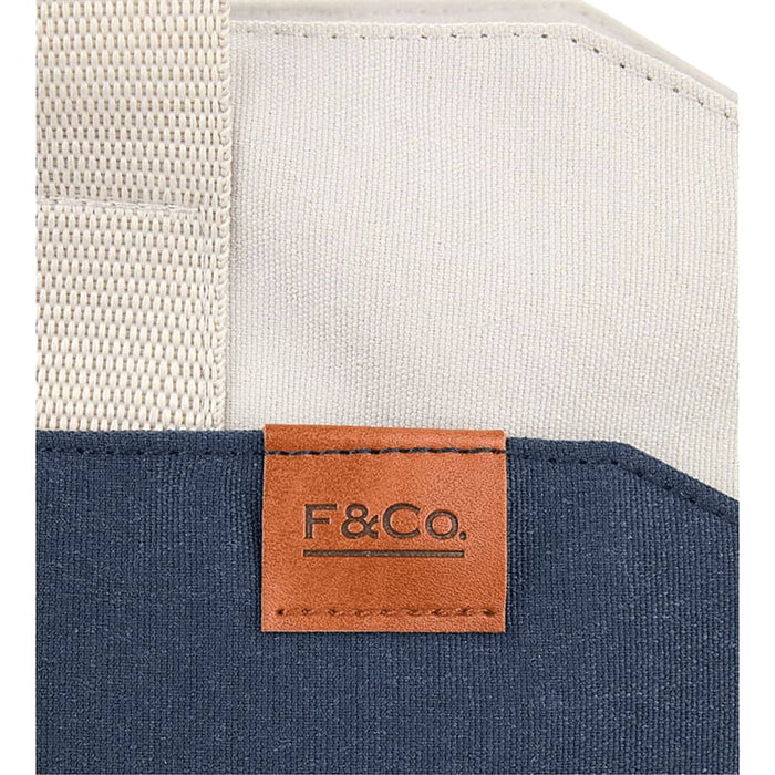Field & Co.® Parks 16" Computer Work Tote - A navy and cream tote bag featuring a leather tag with branding and sturdy woven straps.