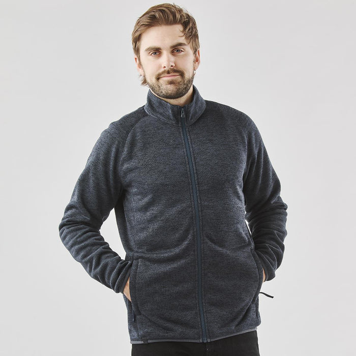 Men's Yosemite Full Zip Fleece Jacket - A man wearing a navy polar fleece jacket with a full zip, featuring a collar and side pockets.