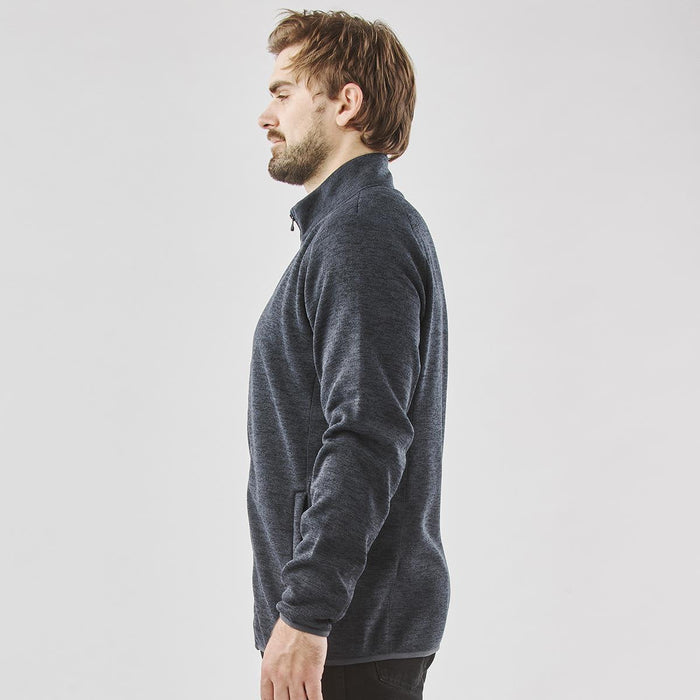 Men's Yosemite Full Zip Fleece Jacket - A men's full zip fleece jacket in dark navy, featuring a high collar and side pockets. It has a simple logo design.