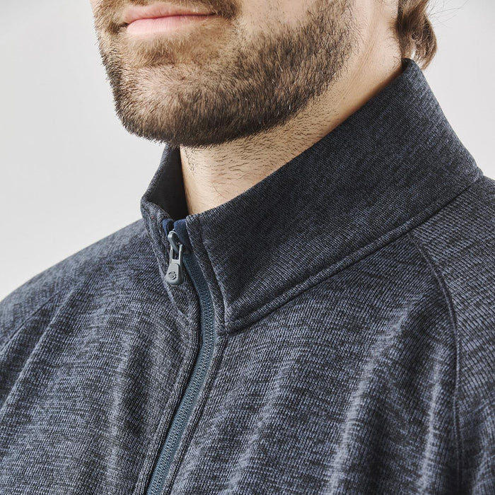 Men's Yosemite Full Zip Fleece Jacket - A grey full zip fleece jacket with a stand-up collar, featuring a branding logo and a textured fabric.