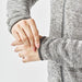 Women's Yosemite Full Zip Fleece Jacket - A close-up of a woman's hands adjusting the cuffs of a grey fleece jacket with a full zip.