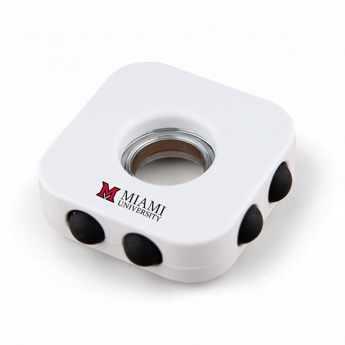 Decompression Finger Spinner - A white decompression finger spinner with three black buttons and a logo.