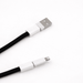 The Power Band Charging Lanyard - 60W - A black charging lanyard with white connectors at both ends, featuring a USB and a Lightning connector.