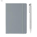 Alison A5 Notebook and Pen Gift Set - A grey A5 notebook with a matching elastic band and a silver pen beside it. The notebook features a logo on the cover.