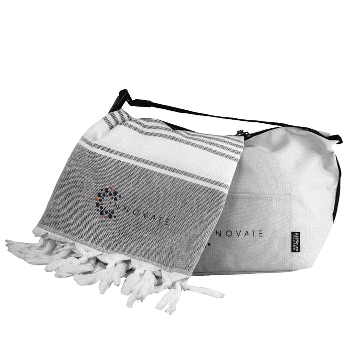 Towel & Cooler Bundle Pack - A grey and white towel with tassels alongside a grey cooler bag, both featuring a logo.