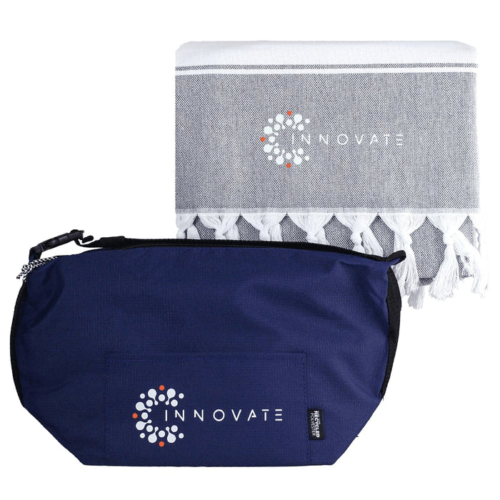 Towel & Cooler Bundle Pack - A navy cooler bag and a grey towel with tassels, both featuring a logo.